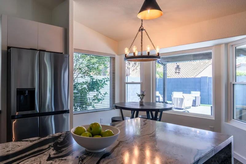Remodeled Phoenix, AZ kitchen with leathered granite island and breakfast nook