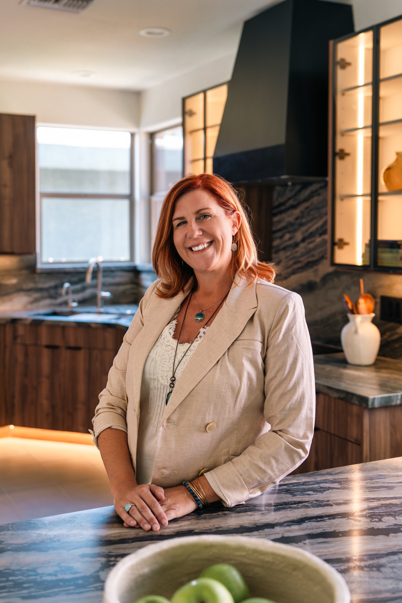 Audrey, founder of Artisan Design Remodel, in a completed Phoenix kitchen remodel