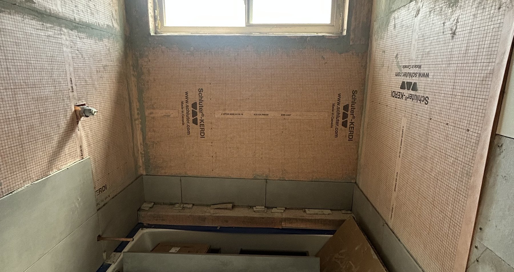 Schluter-Kerdi waterproofing system installed after tearing out the previous contractor's improper work, Goodyear guest bath rescue