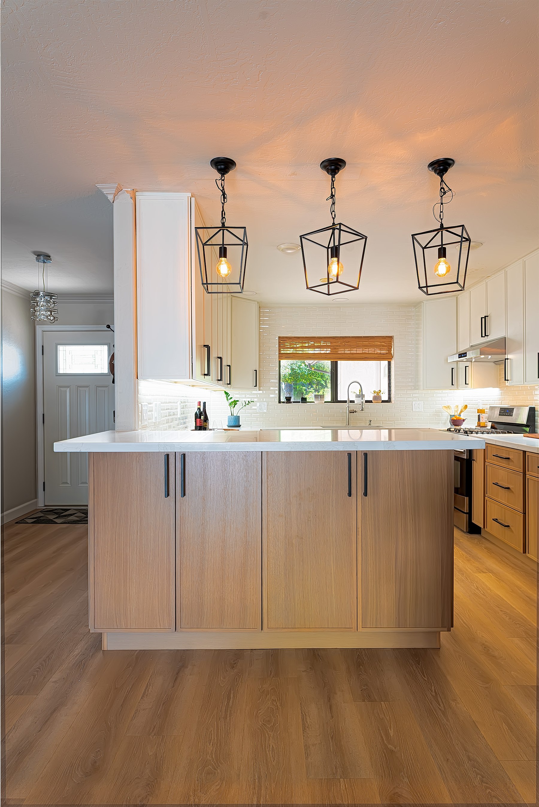 Wide view of the finished kitchen island with pendant lighting, Phoenix remodel