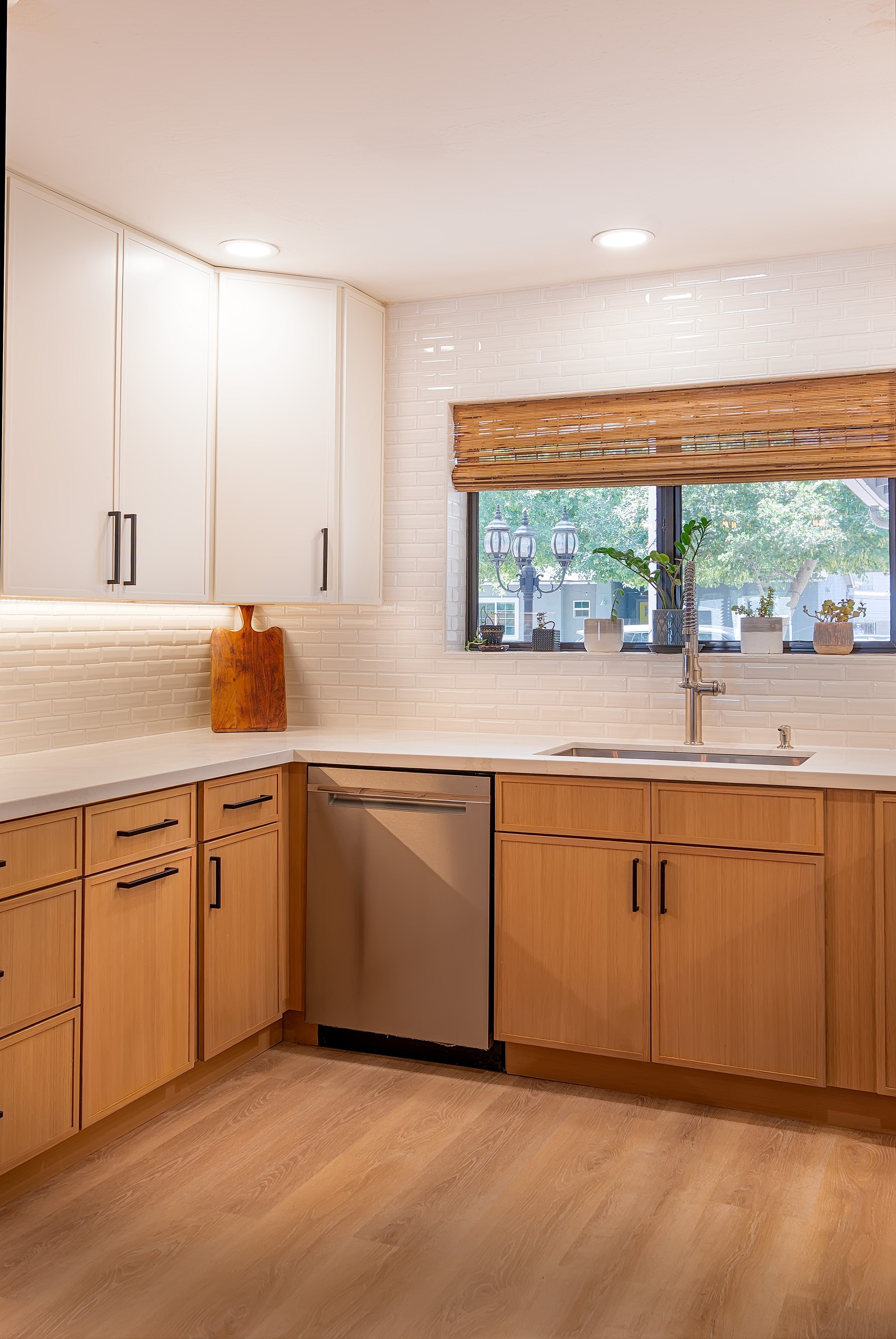 Finished sink wall with white subway tile and LVP flooring, Phoenix remodel