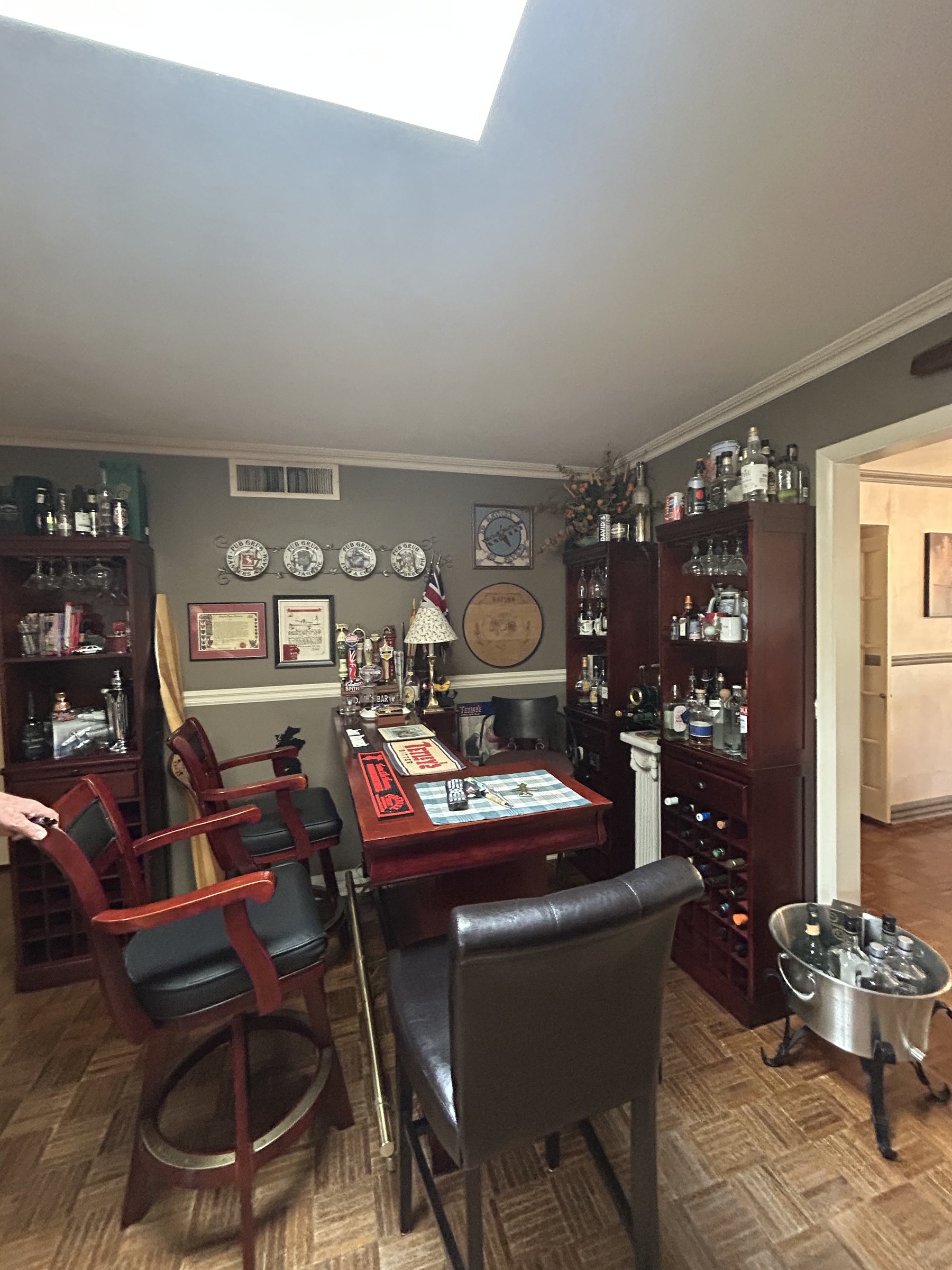 Original den and wet bar area with dated parquet flooring before the whole-home remodel, Scottsdale remodel